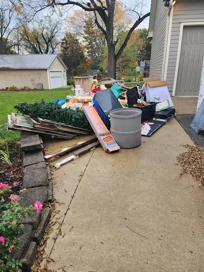 Dumpster being loaded with debris for Demolition Dumpster Rental in Forestville